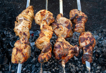 Barbecue chicken on the grill. Cooking meat in the fresh air.