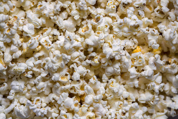 A scattering of cooked popcorn. View from the top. Background.
