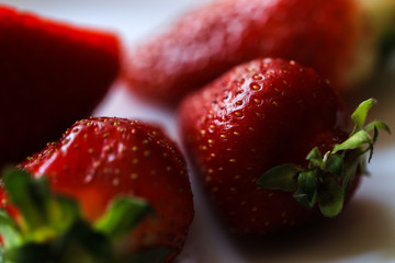 Ripe strawberry close up, shallow depth of field, phone wallpaper