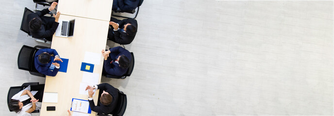 Top viwe. Handsome senior businessman coach speaker giving a presentation in conference at team...