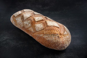 Loaf of bread on a dark background