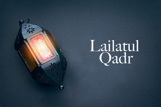 LAILATUL QADR text with lantern lamp on black background.