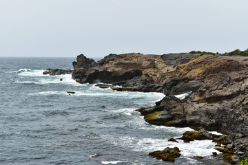 Fototapeta na wymiar Views of the sea from a rocky shore
