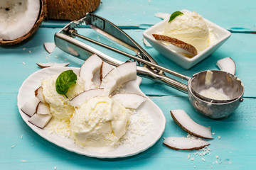 Lactose free coconut ice cream. Special spoon, halves of fruit, flakes