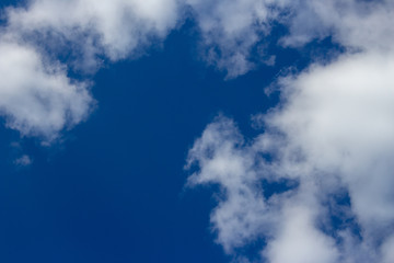 light blue sky with white clouds