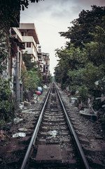 a railway that divides the city into several parts with a passing train