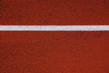 Colorful sports court background. Top view to red field rubber ground. texture
