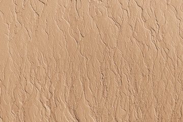 Patterns texture of sand left in the beach by receding tidal waters at the sea shore beach