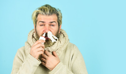 Cold flu remedies. Runny nose recovery. Runny nose and symptoms of cold. Fast recovery. Man scarf...