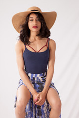 Thoughtful woman in a straw hat