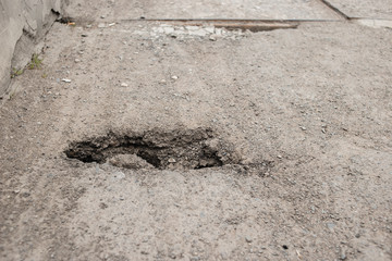 A hole in the asphalt, Danger. Road destruction