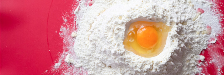 Mountain flour with deepening and egg. Kneading the dough
