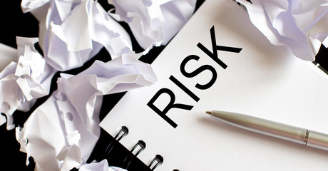 Business Words on notepad, business tex Risk