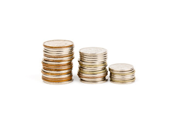 The stack of coin on white background, concept of calculating expenses, incomes and expenses.
