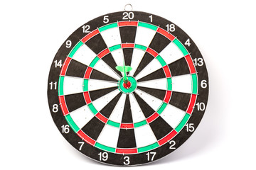 Dartboard with darts on white background, closeup. Purpose concept