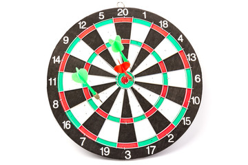 Dartboard with darts on white background, closeup. Purpose concept