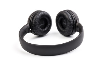 Black wireless headphones on white background.  Advanced acoustic stereo sound system