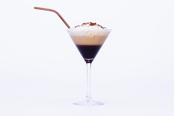 cocktail glass with a delicious capuccino with straw