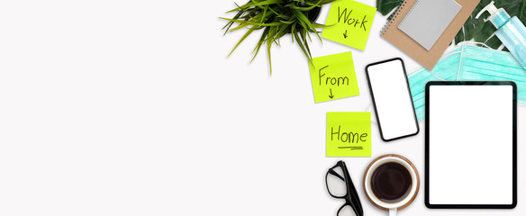 Work space office desk table top header at home layout right have mock up tablet isolated, mask, alcohol gel, coffee, book, plant, notes work from home virus covid-19 scourge stay at home 