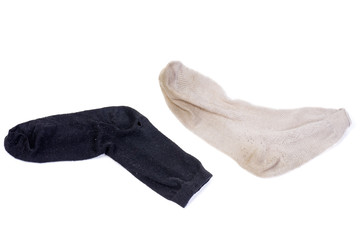 dirty black and white socks isolated on a white background