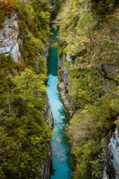 Large thin River in the middle of the forest Pyrenees