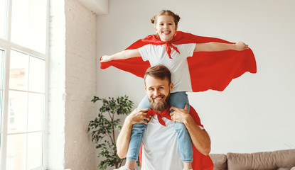 Positive father and daughter spending time together at home.