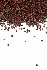 vertical coffee abstraction. brown coffee beans scattered on a white background. grains fall from the top of the frame and fall down. coffee background for a menu, cover, or ad with an empty space