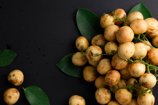 Rambeh, rambi on black concrete background with leaves as the composition.