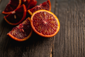 Sweet juicy red oranges on the rustic background. Selective focus. Shallow depth of field.
