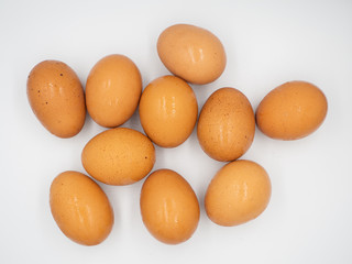 Eggs are placed packly on the white floor and abstractly