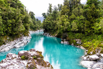Blue water of the Hokitika River through the rock sided at Hokitika Gorge Scenic Reserve, West...