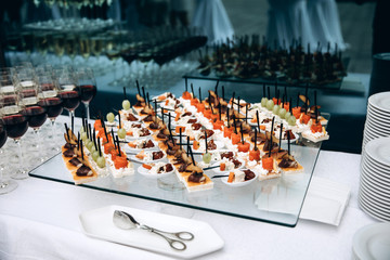 A festive table awaits guests. A variety of salads and cold dishes.