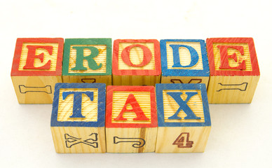 The term erode tax displayed visually on a clear background using colored wooden toy blocks image in horizontal format with copy space