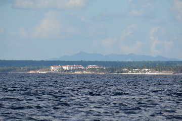 distant coast in Dominican republic, with hills and buildings