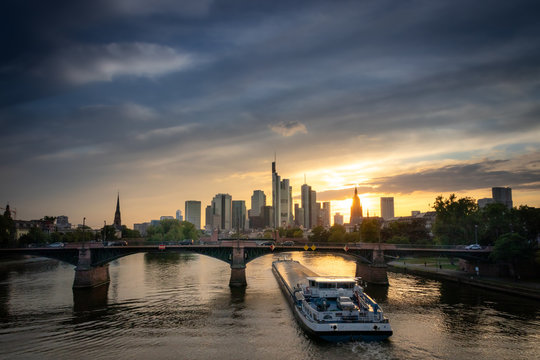 a river ship at sunset in frankfurt germany