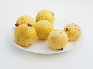 Guava fruit on white plate..