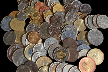 Background image in the form of a placer of coins of different countries and continents