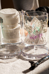 Cotton pads and cotton ear buds, the health care supplies in a bathroom 