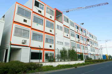 Prefabricated modular offices. Stacking of boxes for construction site.