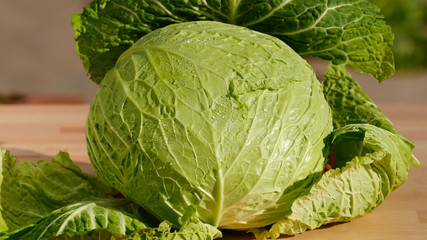 Fototapeta premium Closeup, cabbage, fresh organic green vegetables on wooden board, healthy eating