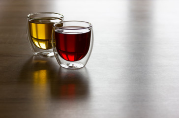 Two glasses of colorful drinks