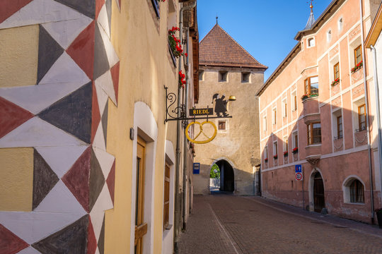 Glorenza, Italy - September 18, 2019: A street is leading towards one of the many tower gates in the Italian village of Glorenza, situated in the valley Val Venosta in the region of Alto Adige (Italy)