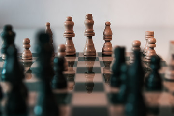 Detailed chess shot with greeny color theme. Elegant and classic boardgame.