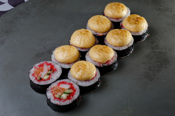 sushi rolls on black plate