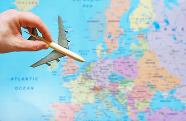 Fototapeta na wymiar Toy plane and Europe map on the background.