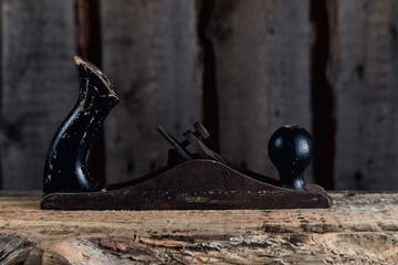 old carpentry tools on wooden background