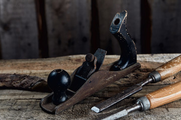old carpentry tools on wooden background