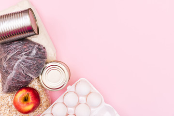Food supplies crisis food stock isolation period on pink pasta, oatmeal, canned food, sugar, toilet...