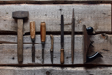old carpentry tools on wooden background