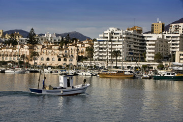 Fishing boat entering the port of Estepona, malaga province, Spain